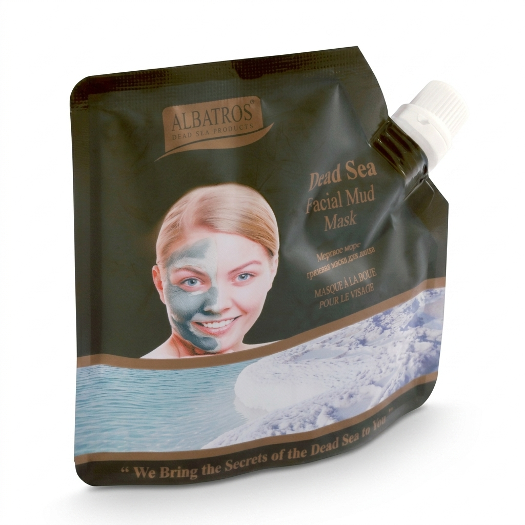 Albatros Dead Sea Facial Mud Mask in a dark brown squeeze pouch with a white cap, featuring a model wearing a blue mask and an icy ocean graphic.